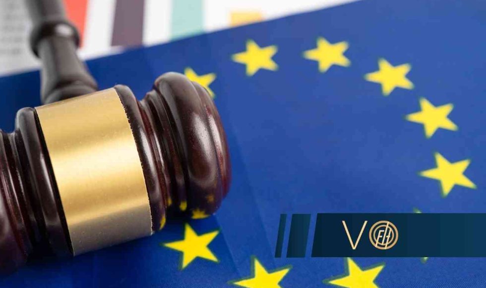 Gavel resting on an EU flag, symbolizing European Union law or regulation.